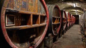 A wine cellar with old oak barrels in the Rhone Valley