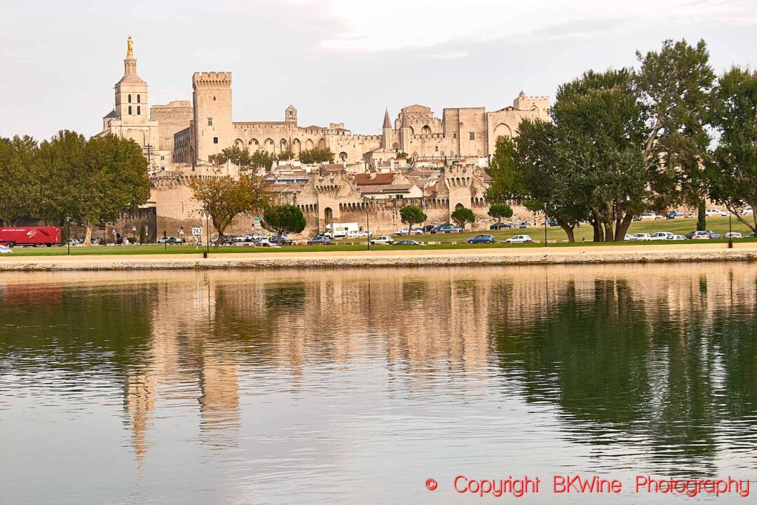 The majestic Pope's Palace in Avignon reflected in the Rhone River